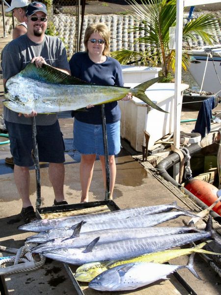 10-22-04
4 Big Ono, 2 Mahi Mahi (the Bull weighed 34 pounds) and a Kawa Kawa (Wavy Back Tuna) Awesome! Robert and Stacy had about 3 hours of sleep the night before their trip. But that didn't stop them from knockin' the fish dead! Fun Fun.
