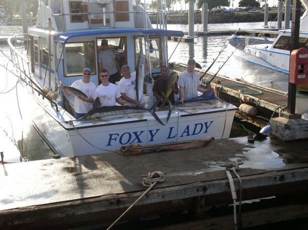 Foxy Lady 11-25-06
Dr. Ross "Marlin" Mathieu, Mike, Jason, Grant and Randel caught a few Striped Marlin (because that's just what Ross does). Then a few Mahi Mahi, an Ono, an Aku and a little Yellowfin Tuna. And that makes a "Clean Sweep"! All right!!!
