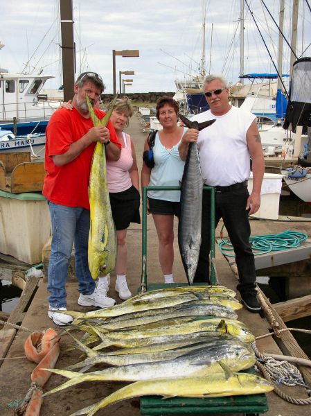 Foxy Lady 3-22-06
Robert, Melody, Jacqueline and Bruce knocked em dead today. 12 Mahi Mahi 18-31 pounds and a nice 31 pound Ono. Not to mention Bruce's 45 minute battle with a 300 pounds Galapagos shark. All caught on 25 pound class stand up rods, we had 3 doubles and 1 triple hookup. It was some serious action! 
Glad we waited until 6 am to get that extra case of beer... After catching all those fish, Robert and Bruce needed it. Thanks again for a great day. See you this summer.

