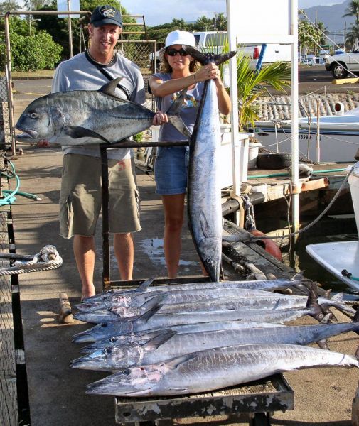 10-12-04
What a great day. Troy and Grace CRUSHED 'em!! They caught 8 big Ono's and a 35 pound white Ulua. These folks know how to fish and were great company on one of the calmest days of the year. Hungry fish, flat water and fun people- perfect!
