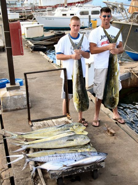 7-4-04
Hunter and Tom's day was pretty darn good. 7 Mahi Mahi, an Ono and a Shibi. All we needed was a Marlin for a clean sweep. We'll get 'em next time.
