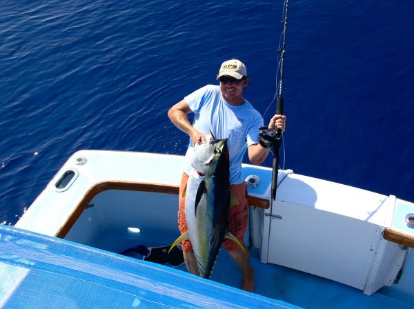 Captain Jesse with his TLD 25, 30# rod and one fat Yellowfin Tuna.
Um, do we get a discount if the captain catches the biggest fish of the day?

