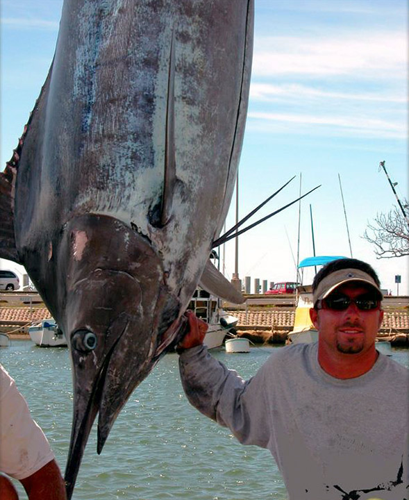 Captain Chris Parker with a Blue Marlin caught off the north shore of Oahu